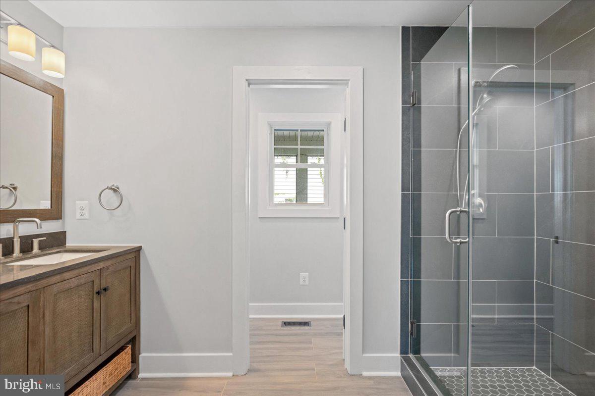 206 Point Lane Solomons, MD 20688 - Photo 26 of 46 a bathroom with a shower
