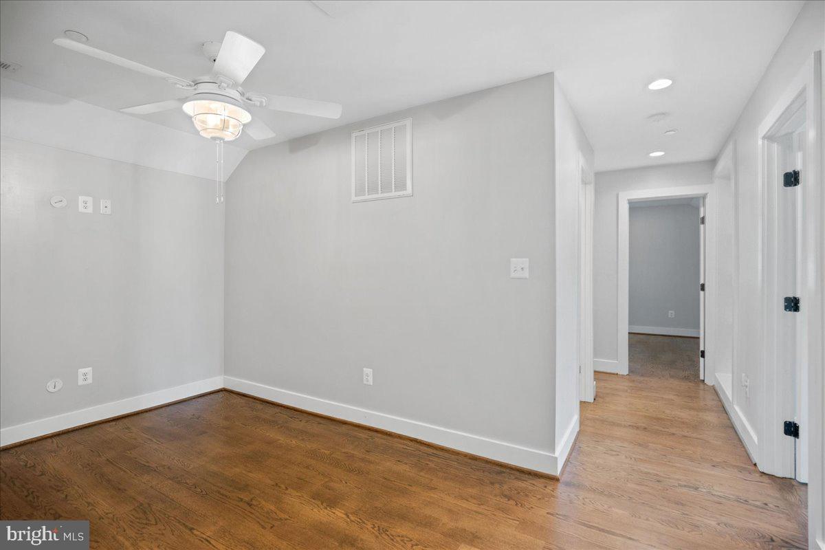 206 Point Lane Solomons, MD 20688 - Photo 30 of 46 wooden floor in an empty room with a window