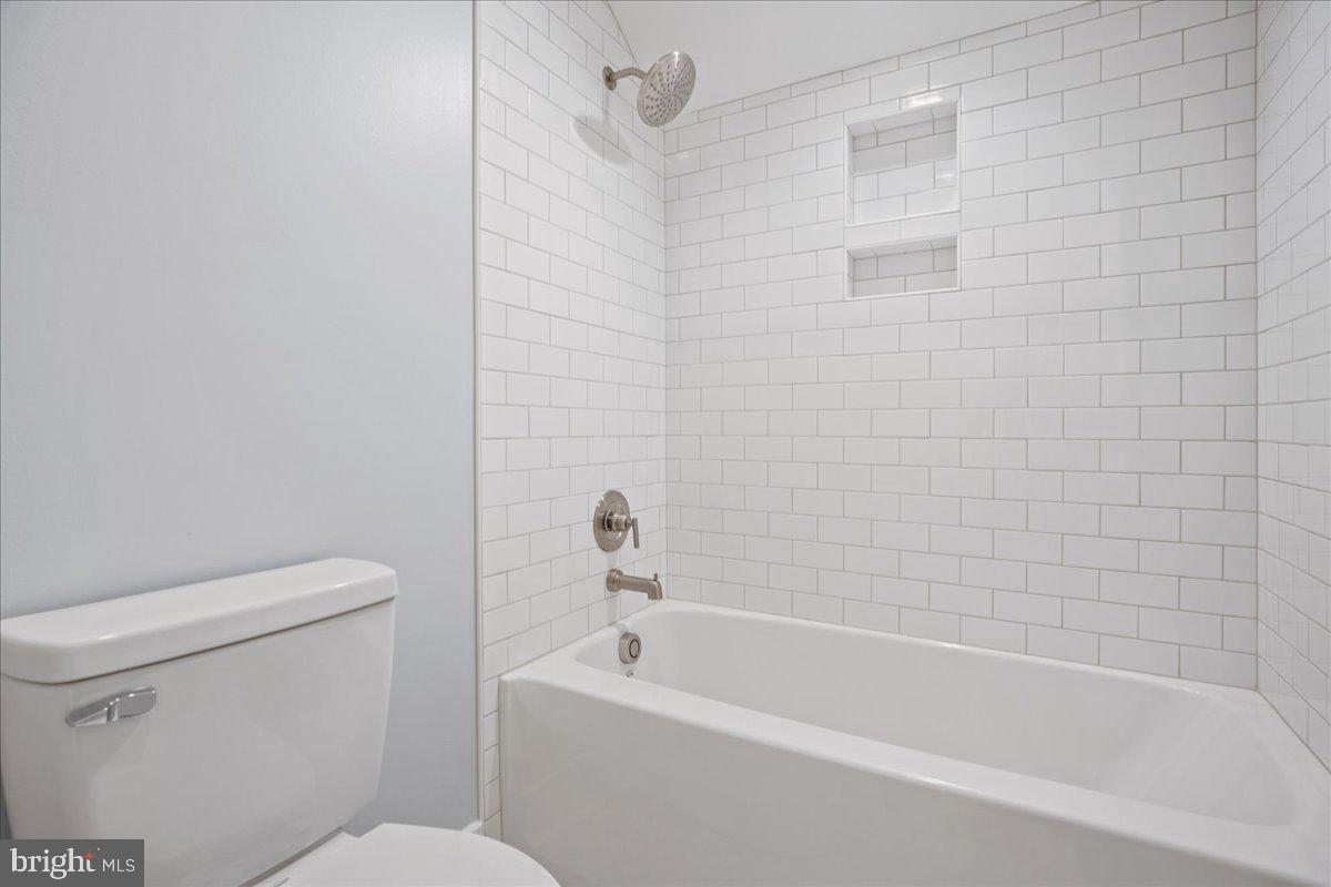 206 Point Lane Solomons, MD 20688 - Photo 35 of 46 a white bath tub sitting next to a white toilet