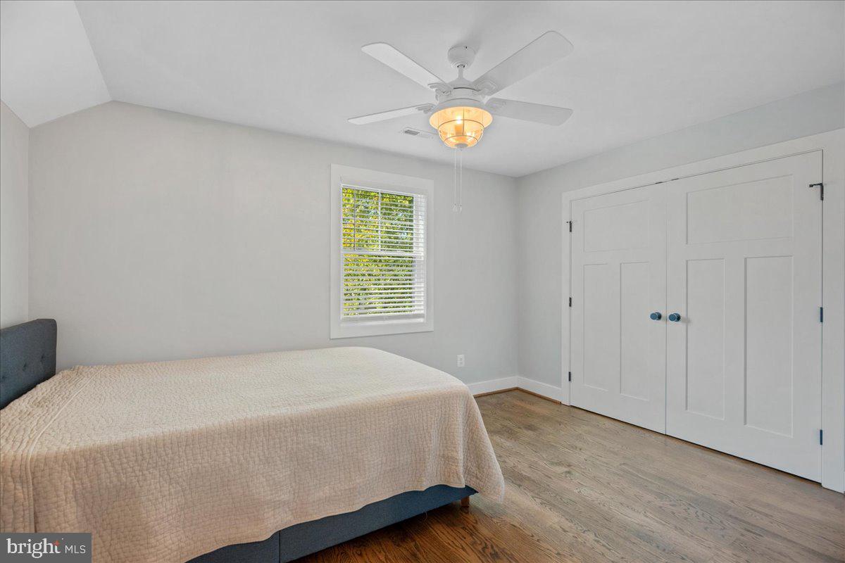 206 Point Lane Solomons, MD 20688 - Photo 36 of 46 a spacious bedroom with a bed and a window