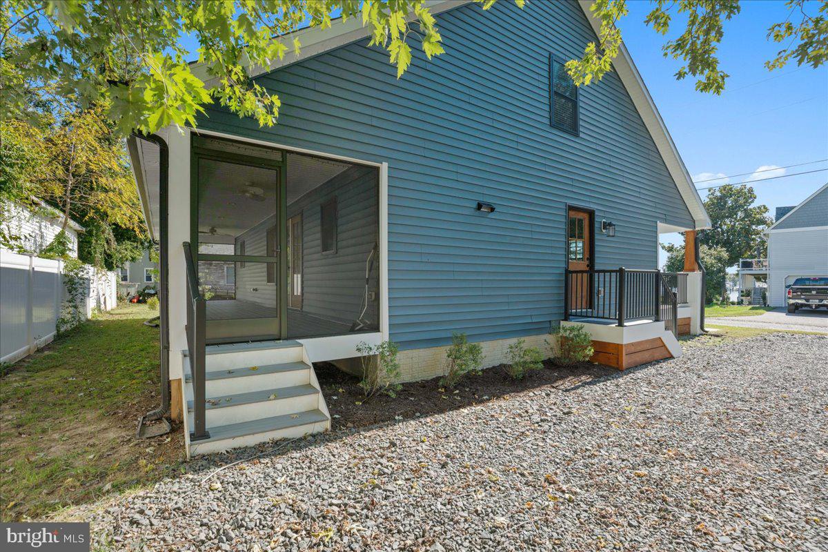 206 Point Lane Solomons, MD 20688 - Photo 40 of 46 a view of a house with backyard and sitting area