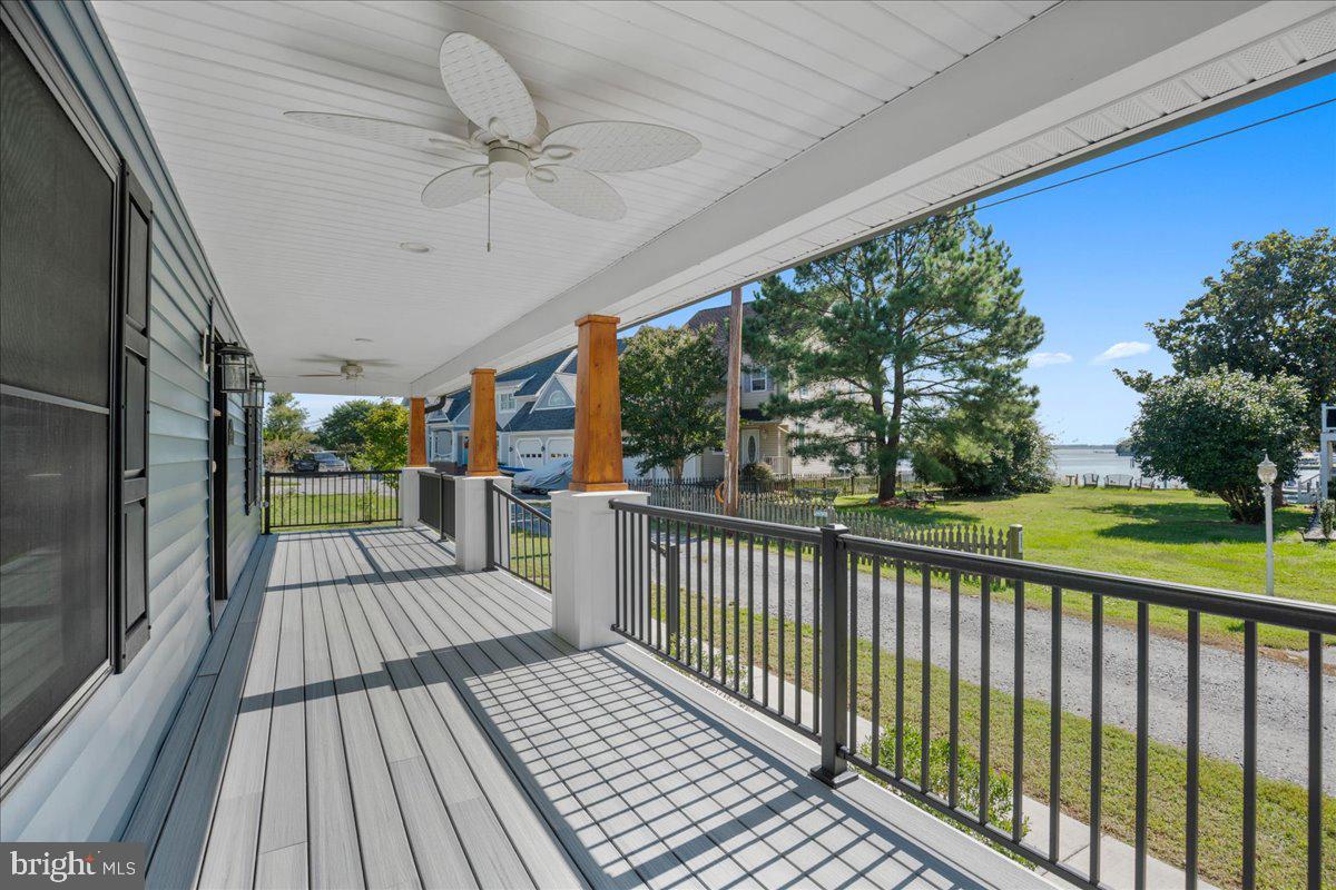 206 Point Lane Solomons, MD 20688 - Photo 4 of 46 a view of a porch with wooden floor and outdoor space