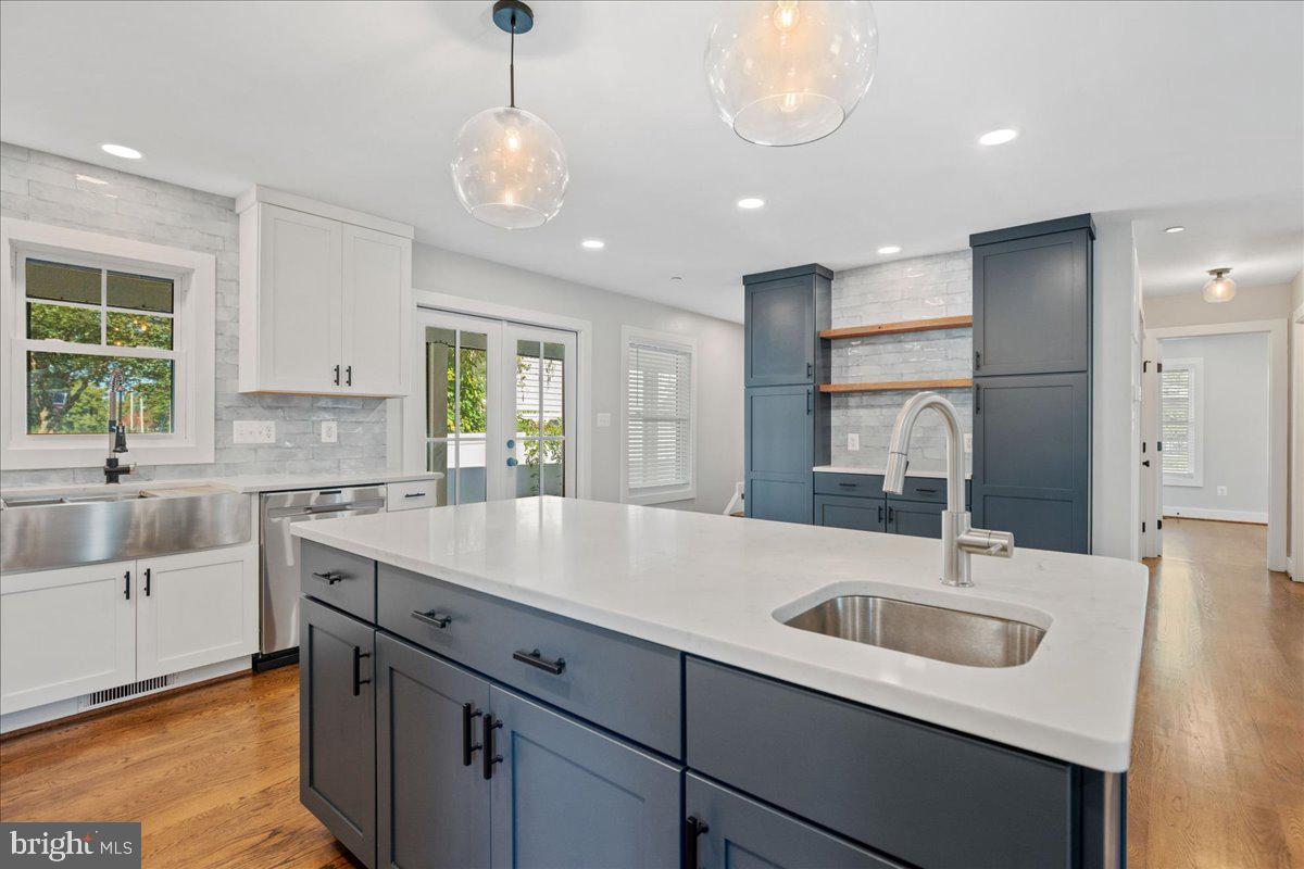 206 Point Lane Solomons, MD 20688 - Photo 10 of 46 a kitchen with a sink stove a microwave and cabinets