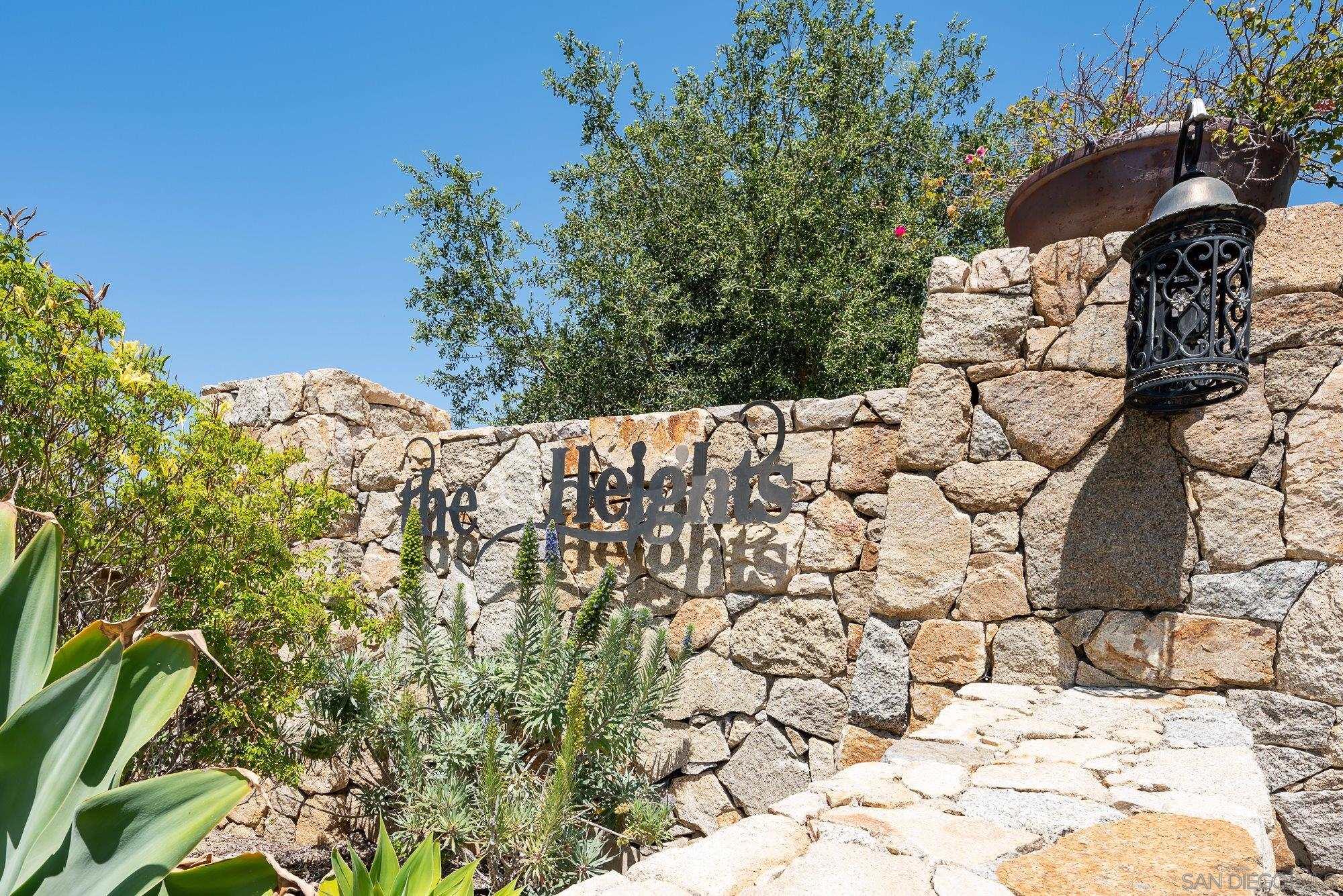14860 Sunset Ridge Court Poway, CA 92064 - Photo 12 of 27 a view of a white house with a yard