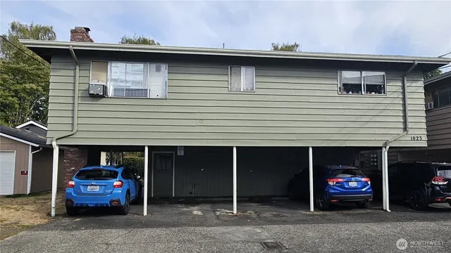 a view of a car park in front of house