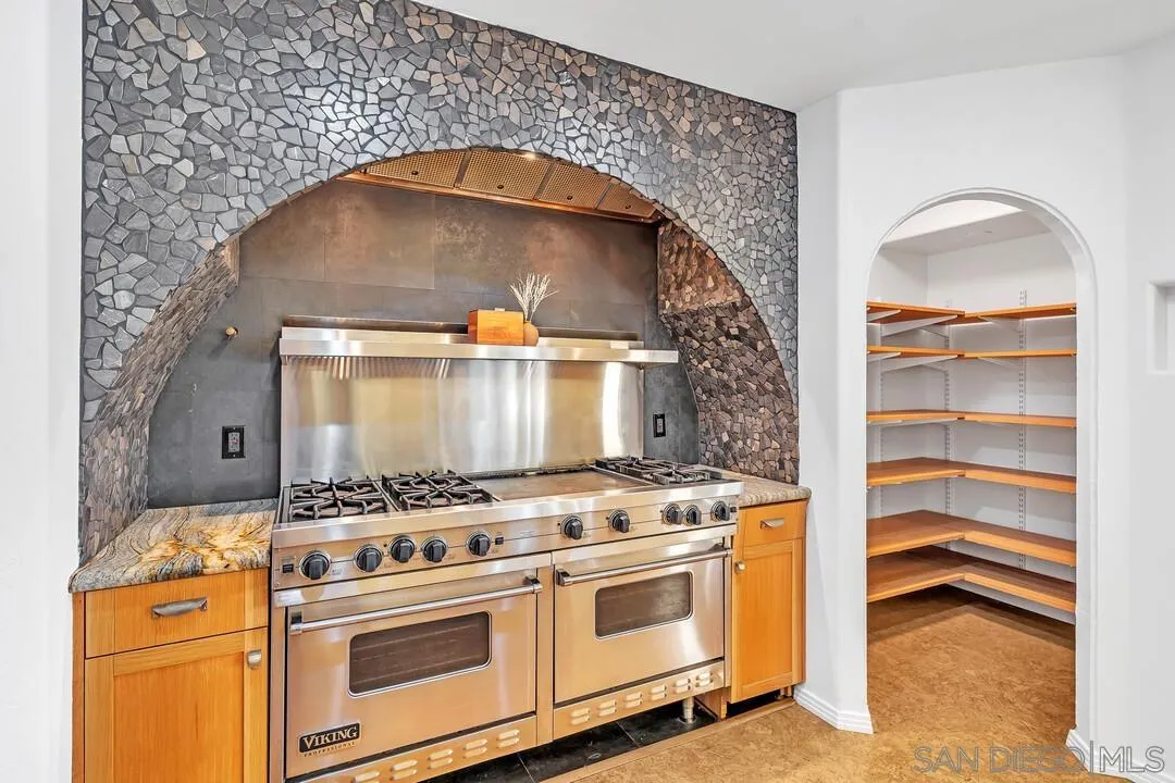 13419 Sebago Avenue Poway, CA 92064 - Photo 18 of 49 a stove top oven sitting inside of a kitchen