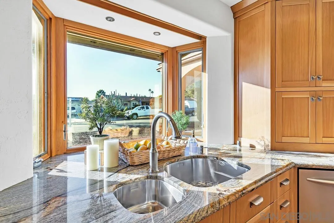 13419 Sebago Avenue Poway, CA 92064 - Photo 19 of 49 a kitchen with a sink and a large window