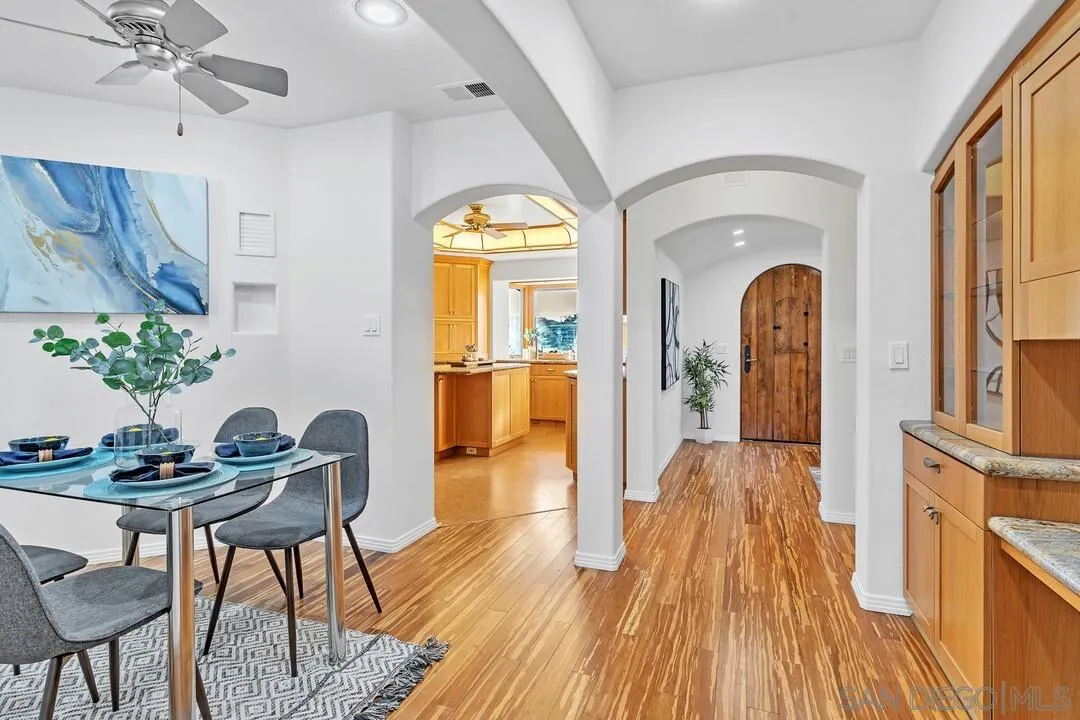 13419 Sebago Avenue Poway, CA 92064 - Photo 21 of 49 a view of a dining room with furniture window and wooden floor