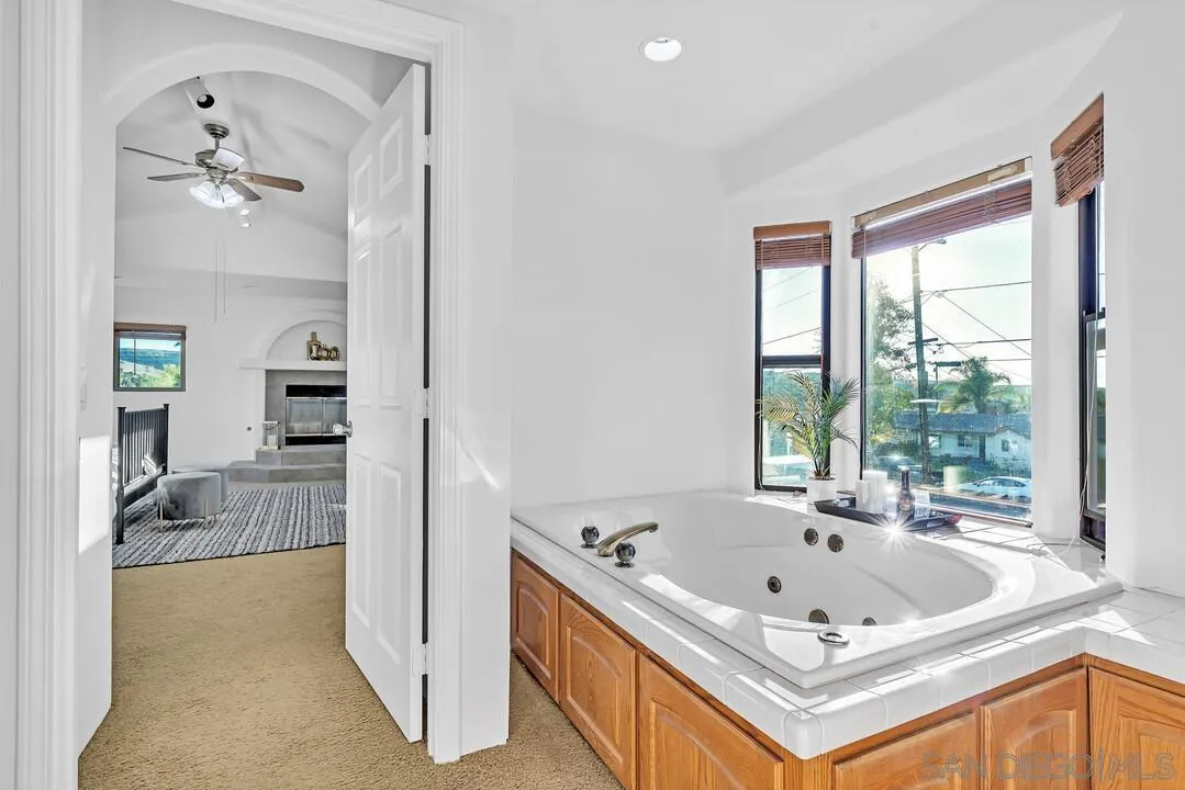 13419 Sebago Avenue Poway, CA 92064 - Photo 36 of 49 a white bath tub sitting next to a bathroom sink