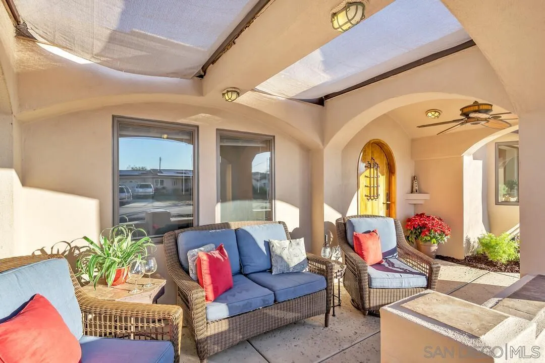 13419 Sebago Avenue Poway, CA 92064 - Photo 6 of 49 a living room with patio furniture and a potted plant