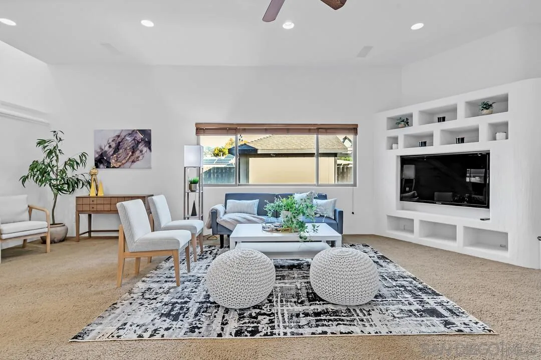 13419 Sebago Avenue Poway, CA 92064 - Photo 9 of 49 a living room with furniture and a flat screen tv