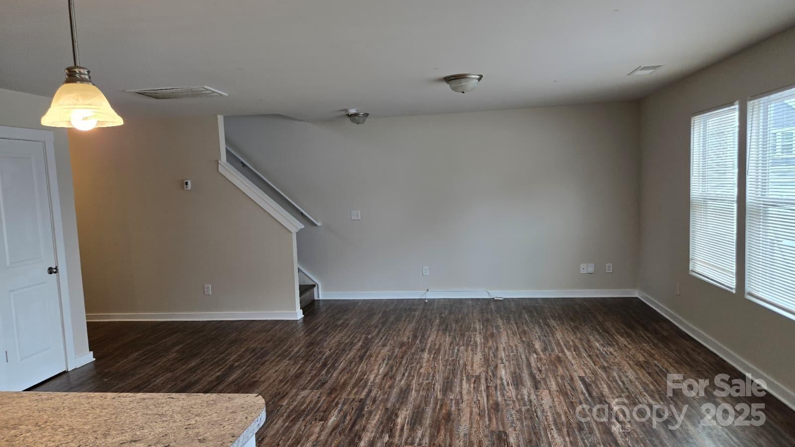 705 Anglin Forest Way Charlotte, NC 28214 - Photo 14 of 36 a view of room with window and wooden floor