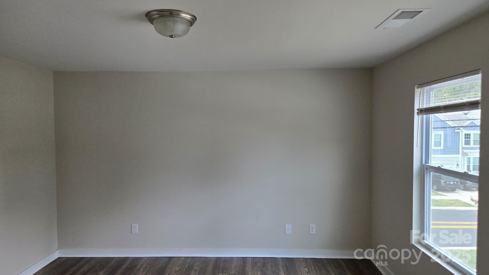 705 Anglin Forest Way Charlotte, NC 28214 - Photo 31 of 36 a view of a livingroom with wooden floor and a window