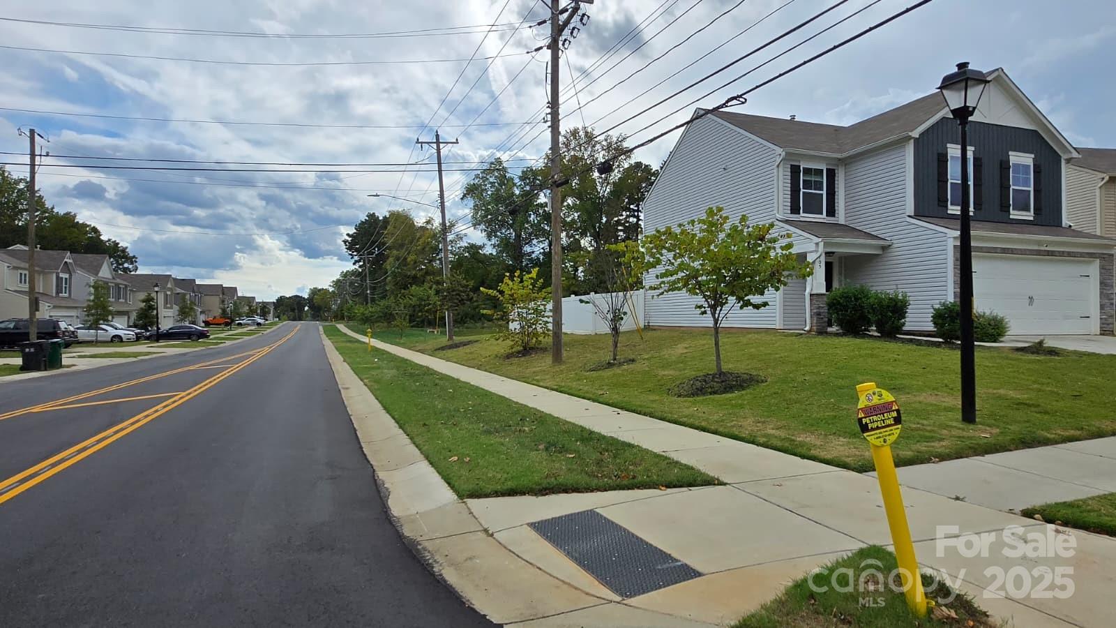 705 Anglin Forest Way Charlotte, NC 28214 - Photo 35 of 36 a view of a house with a yard