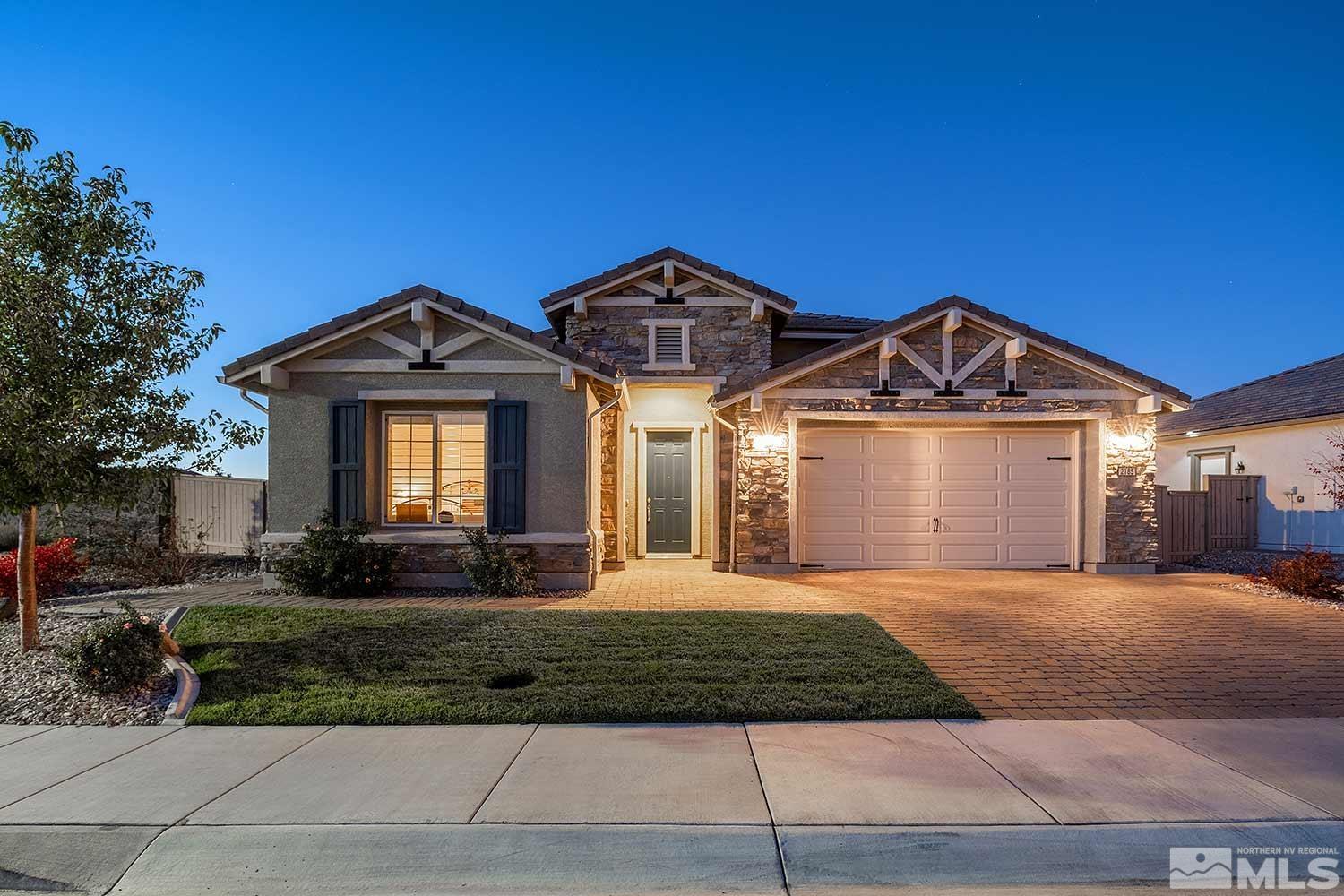 2185 Arpagos Lane Reno, NV 89521 - Photo 2 of 39 a front view of a house with a yard