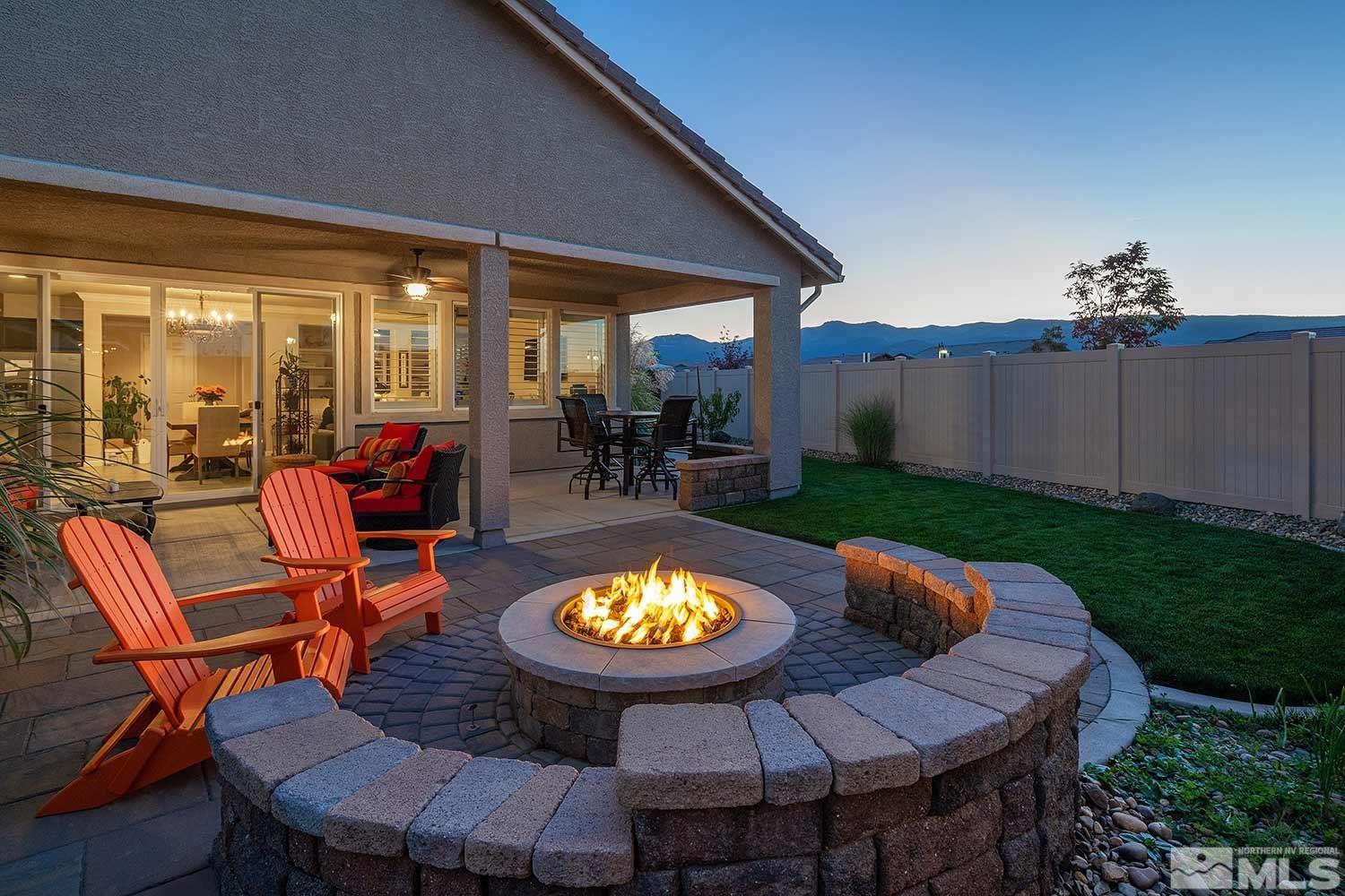 2185 Arpagos Lane Reno, NV 89521 - Photo 21 of 39 a view of a swimming pool with a patio and a yard