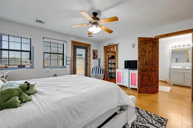 a house view with swimming pool and trees in the background