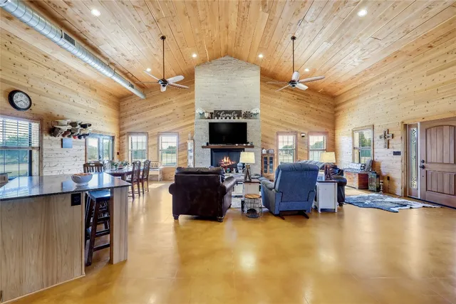 a kitchen with stainless steel appliances granite countertop a sink a stove and cabinets