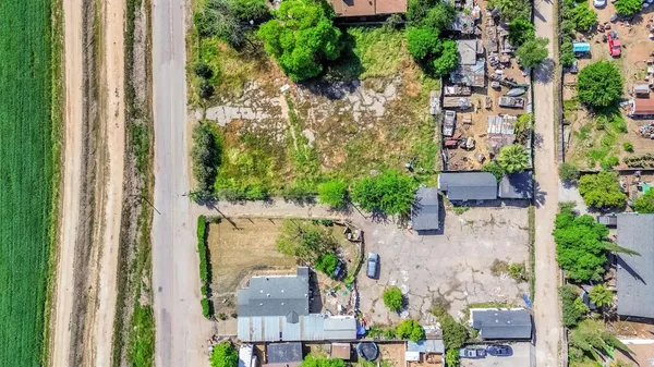 an aerial view of a house with outdoor space