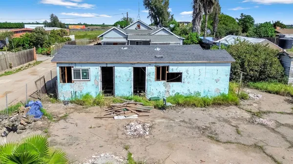 a aerial view of a house with a yard