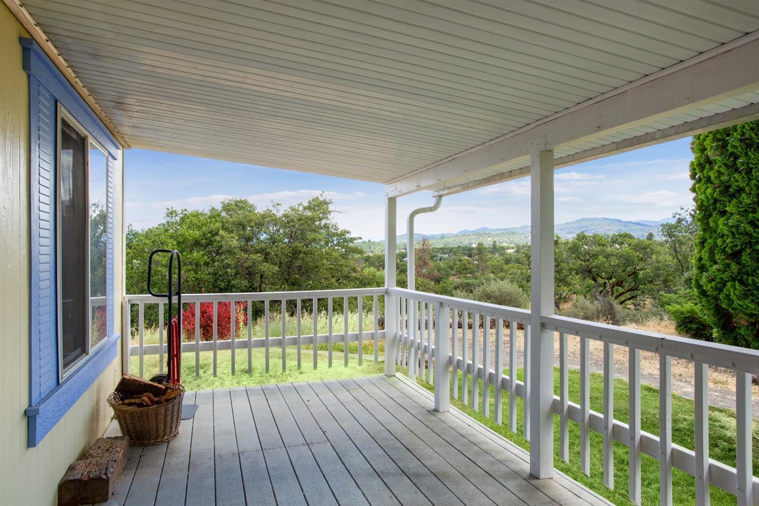 940 Ayres Road Eagle Point, OR 97524 - Photo 7 of 35 a balcony with wooden floor and outdoor space