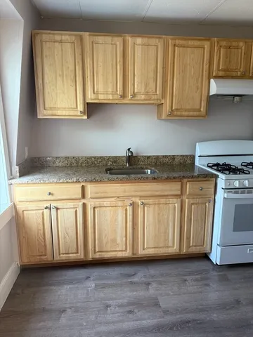 a view of a kitchen with electric appliances