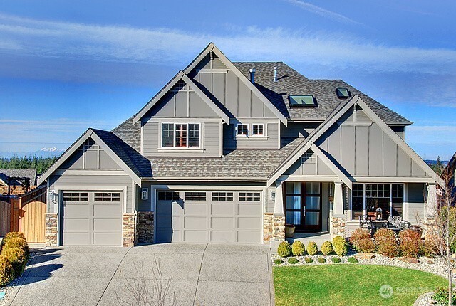 27481 254th Place Southeast Maple Valley, WA 98038 - Photo 1 of 1 a front view of a house with a yard