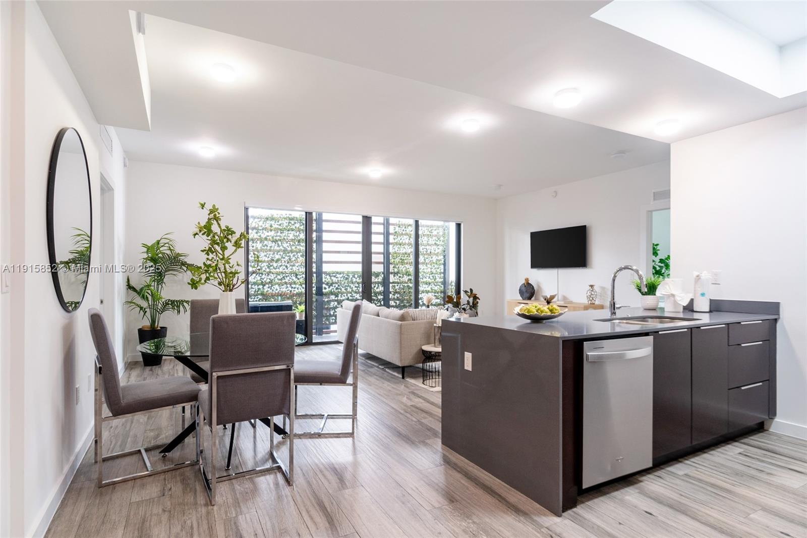 2955 Bird Avenue, Unit 2B Miami, FL 33133 - Photo 1 of 16 a view of a dining room with furniture window and outside view