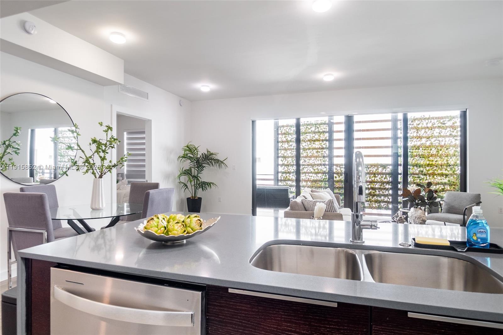 2955 Bird Avenue, Unit 2B Miami, FL 33133 - Photo 4 of 16 a kitchen with sink and a large window
