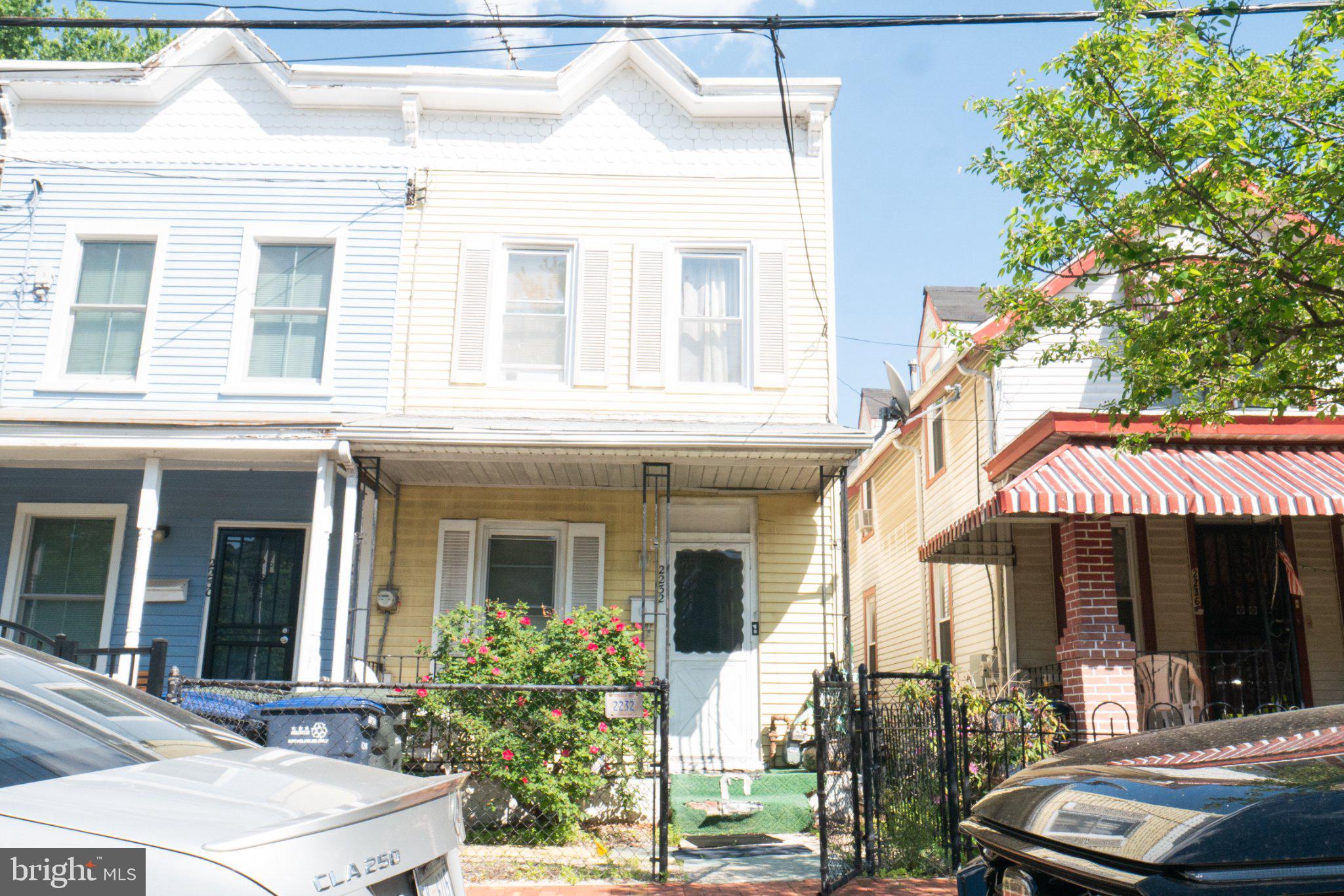Charming duplex with vibrant curb appeal.