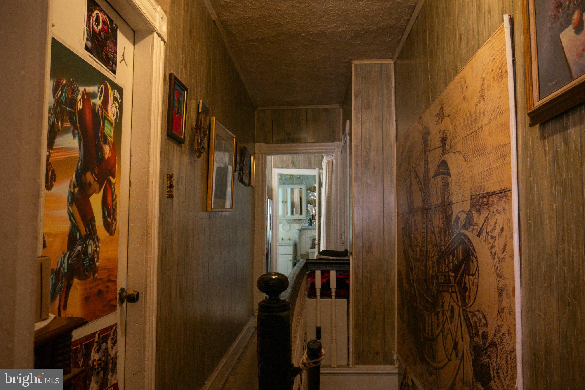 2232 Chester Street Southeast Washington, DC 20020 - Photo 17 of 35 Nostalgic hallway with eclectic art.