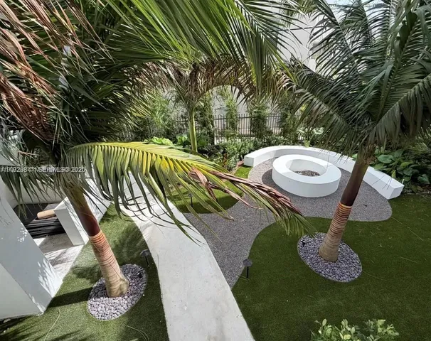 a view of a swimming pool with a yard