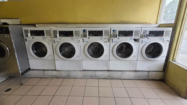 a bathroom with a bathtub and a flat screen tv
