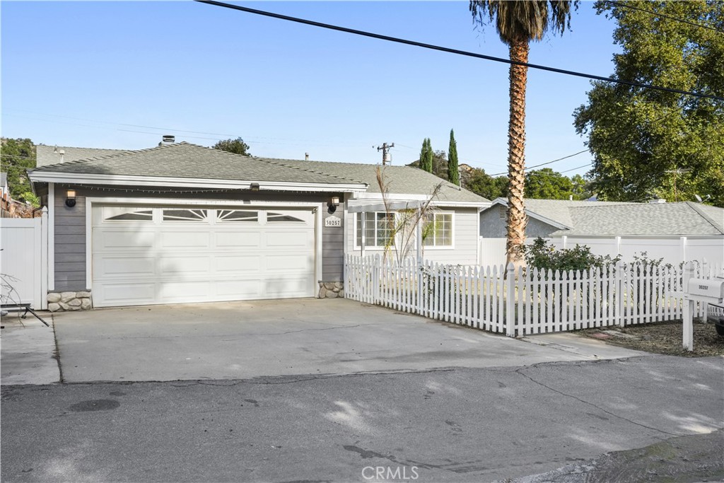 a view of a house with a fence