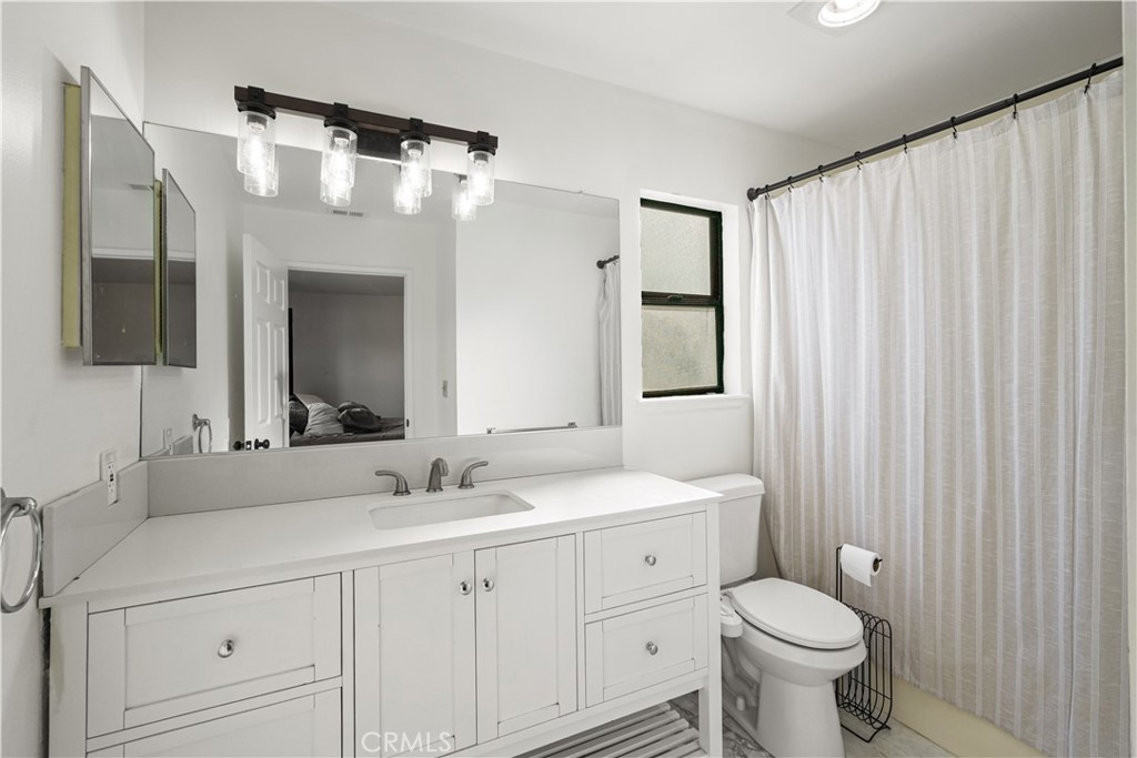 30257 Trellis Road Val Verde, CA 91384 - Photo 20 of 20 a bathroom with a double vanity sink mirror and toilet