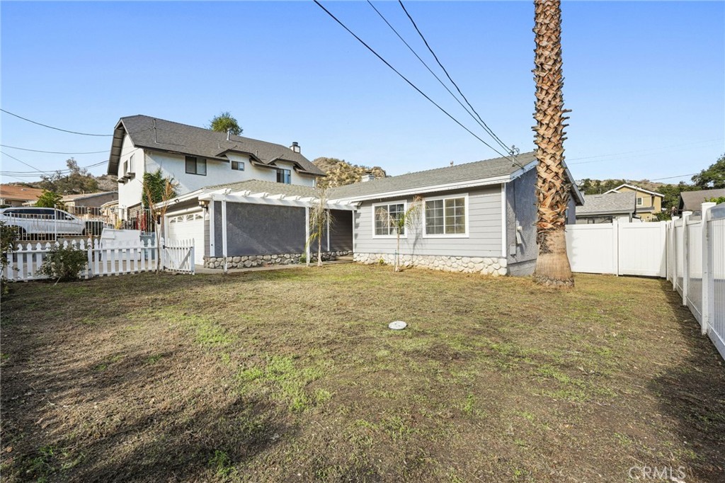 30257 Trellis Road Val Verde, CA 91384 - Photo 5 of 20 a front view of a house with a yard