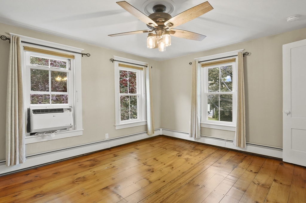 4 Winter Street, Unit 4 Amesbury, MA 01913 - Photo 20 of 39 a view of an empty room with a window and a kitchen