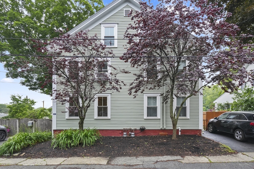 4 Winter Street, Unit 4 Amesbury, MA 01913 - Photo 2 of 39 a front view of a house with a tree