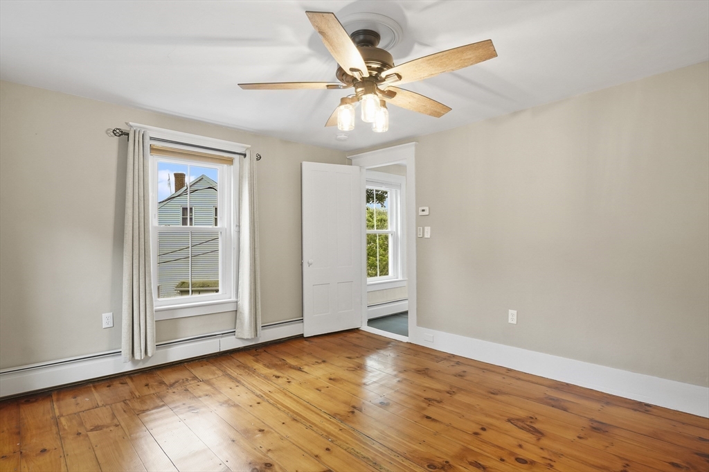 4 Winter Street, Unit 4 Amesbury, MA 01913 - Photo 21 of 39 wooden floor in an empty room with a window