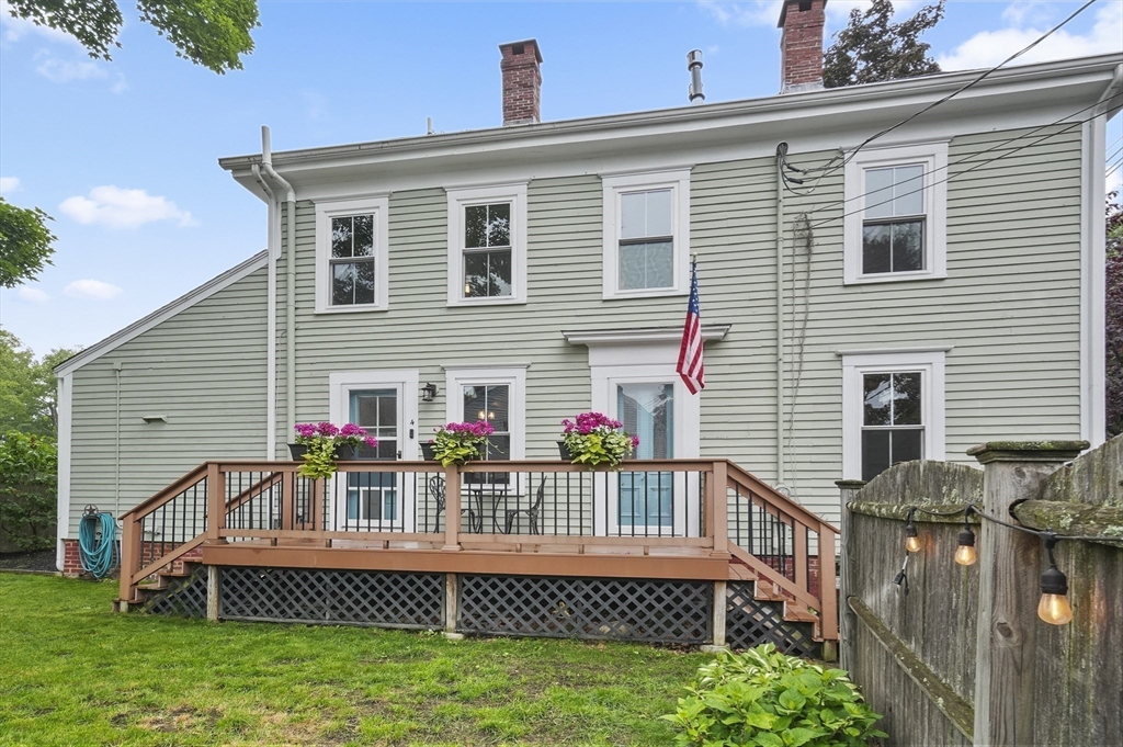 4 Winter Street, Unit 4 Amesbury, MA 01913 - Photo 29 of 39 a front view of a house with a deck