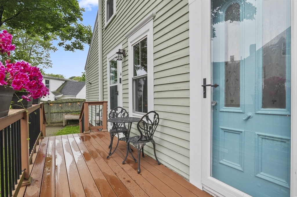 4 Winter Street, Unit 4 Amesbury, MA 01913 - Photo 3 of 39 a balcony with table and chairs