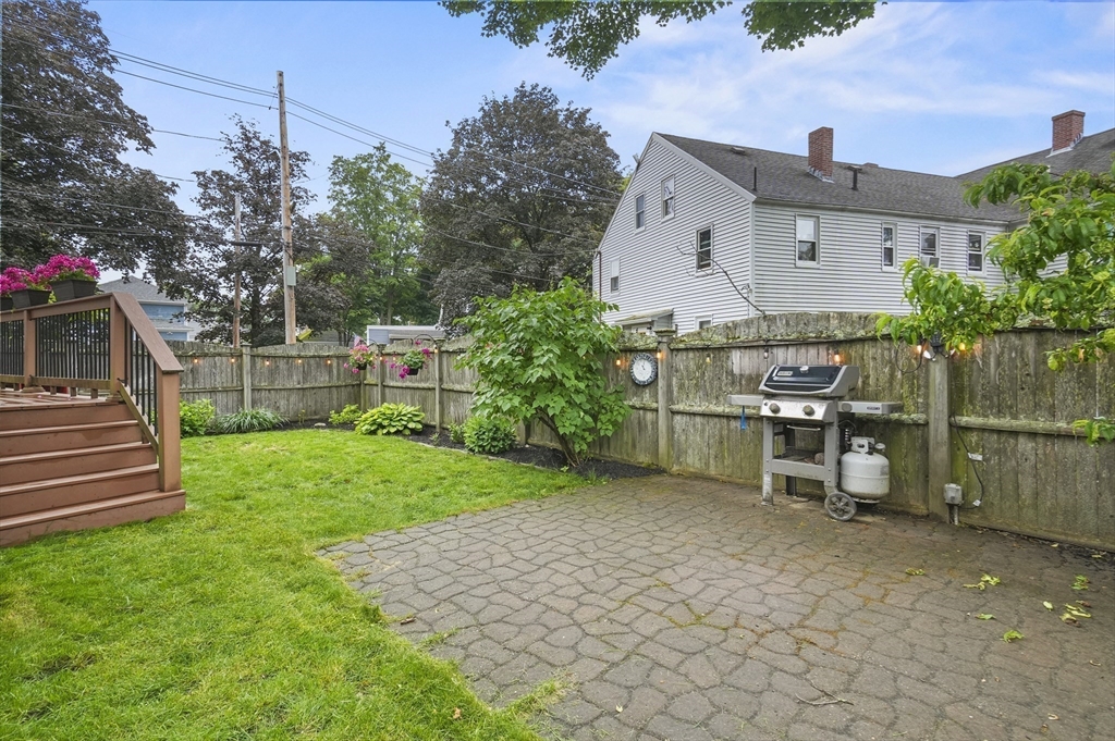 4 Winter Street, Unit 4 Amesbury, MA 01913 - Photo 33 of 39 a view of a house with a yard and sitting area