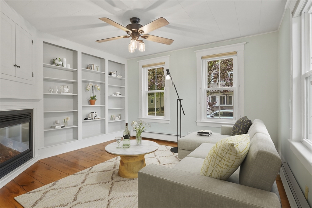 4 Winter Street, Unit 4 Amesbury, MA 01913 - Photo 4 of 39 a living room with furniture and a fireplace