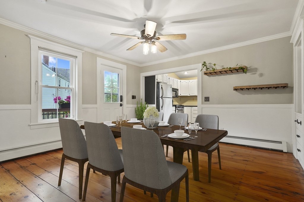 4 Winter Street, Unit 4 Amesbury, MA 01913 - Photo 8 of 39 a view of a dining room with furniture and wooden floor