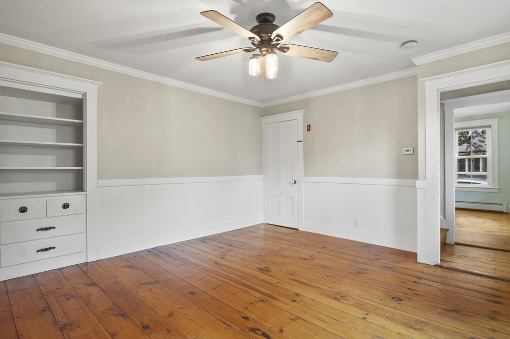 4 Winter Street, Unit 4 Amesbury, MA 01913 - Photo 10 of 39 a view of a room with cabinet and ceiling fan