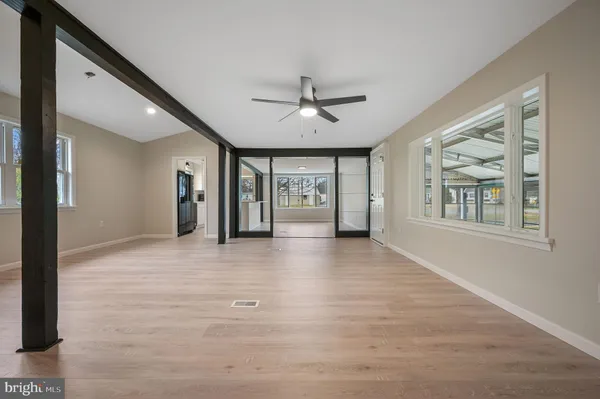 a view of an empty room with a window