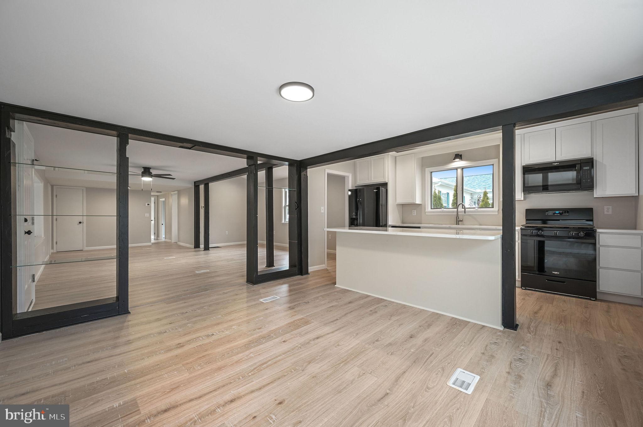 2891 Kenton Road Dover, DE 19904 - Photo 9 of 18 a view of a kitchen with wooden floor and a kitchen