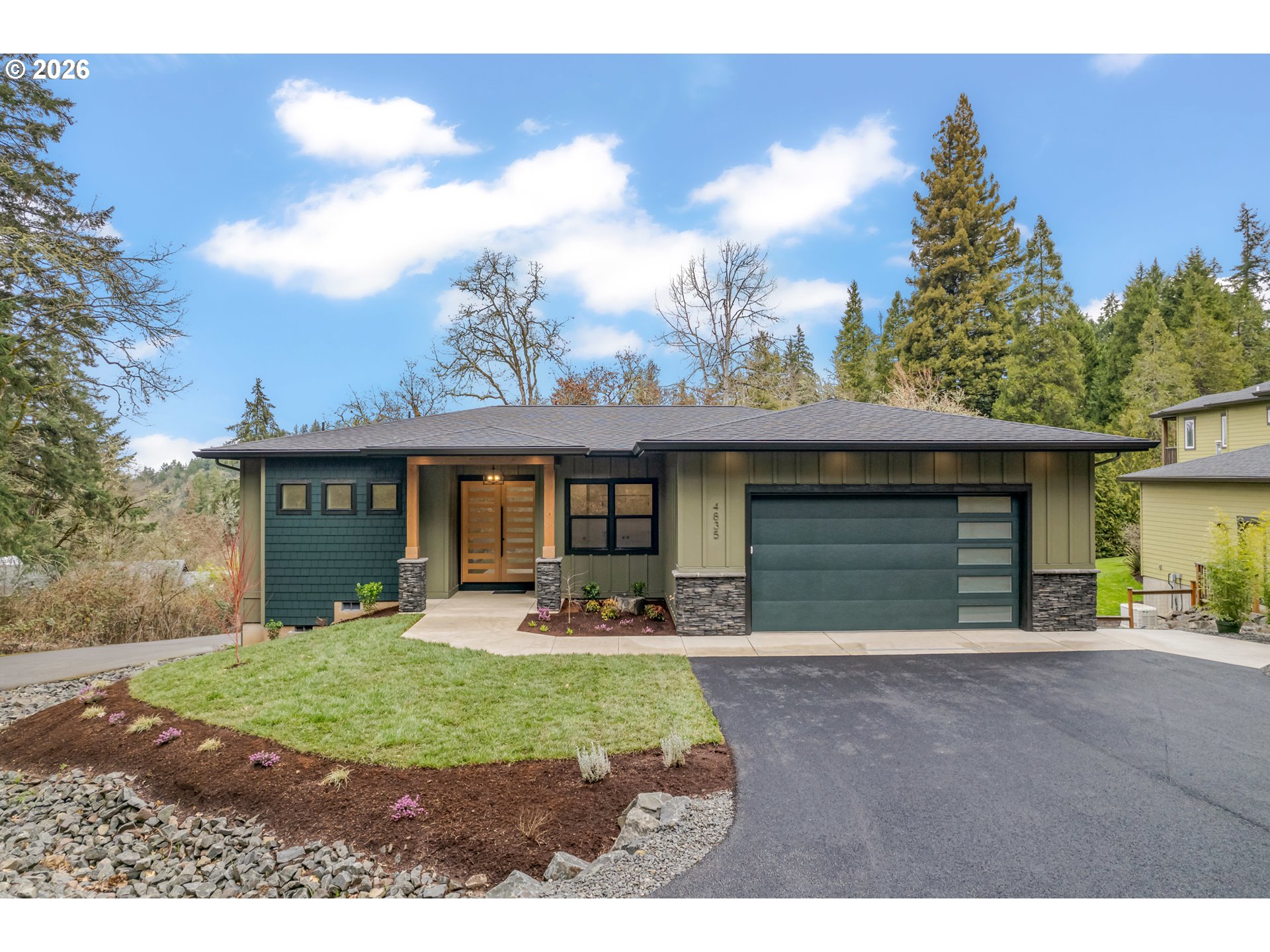4835 Elva Lane Eugene, OR 97405 - Photo 1 of 48 a front view of a house with a yard and garage