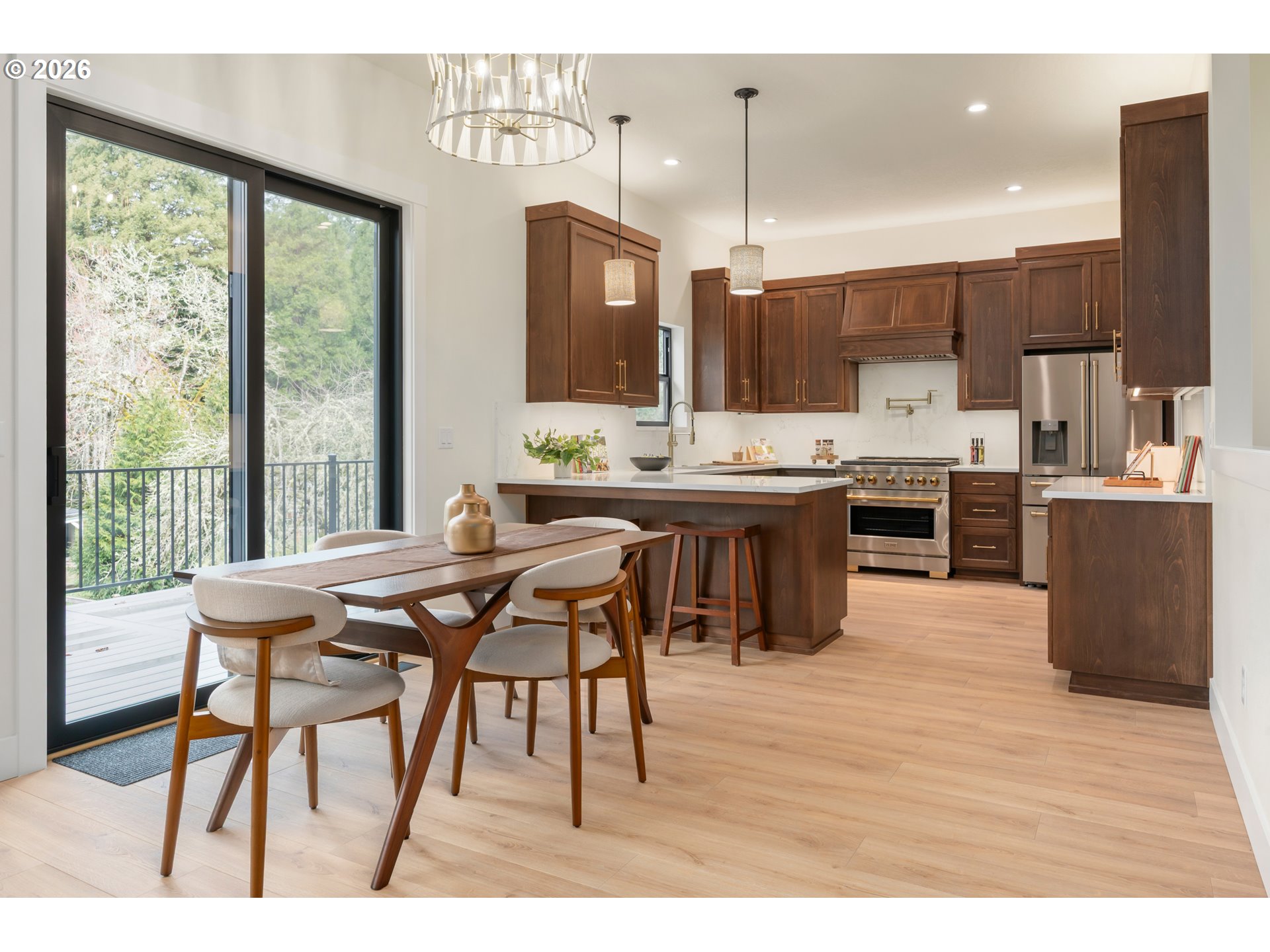 4835 Elva Lane Eugene, OR 97405 - Photo 11 of 48 a view of a dining room kitchen with furniture and wooden floor