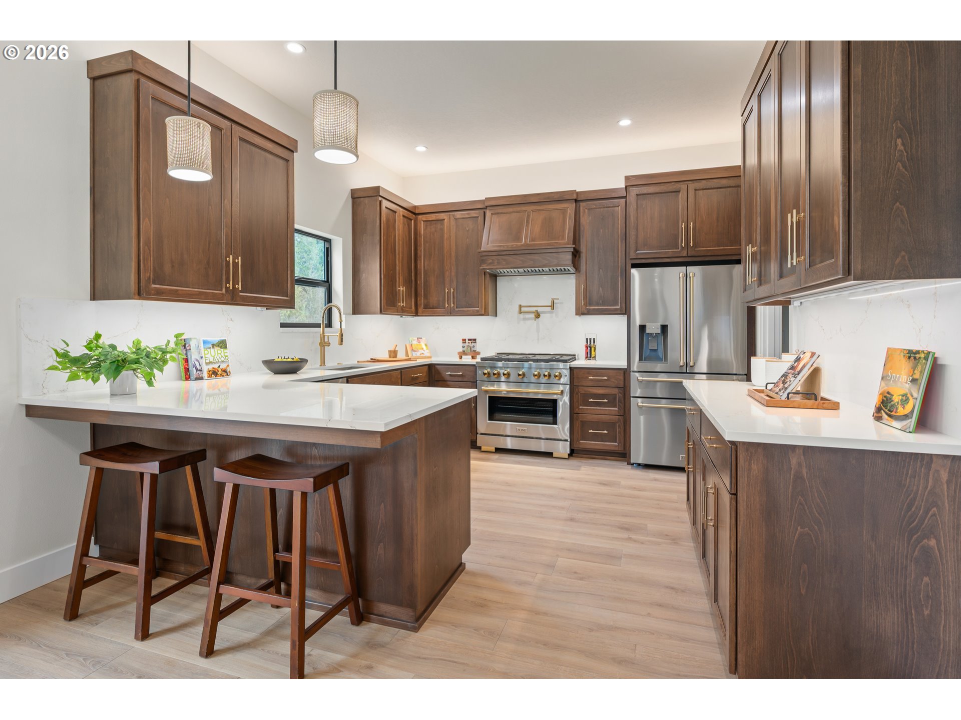 4835 Elva Lane Eugene, OR 97405 - Photo 13 of 48 a kitchen with stainless steel appliances granite countertop a table chairs sink refrigerator and cabinets
